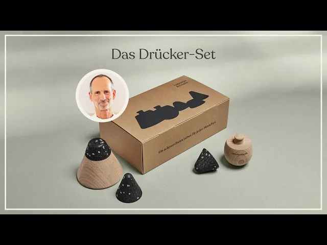 Thumbnail: Drücker-Set von Liebscher & Bracht mit Produktverpackung und Profilbild von Roland-Liebscher-Bracht.
